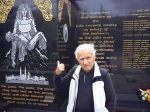 Dad standing in front of one of the political murals in Belfast