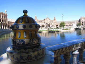 The Plaza de España in Seville, Spain is an architectural wonder. Discount carriers like Ryanair easily and affordably connect Seville with the rest of Europe. how to book the cheapest flight