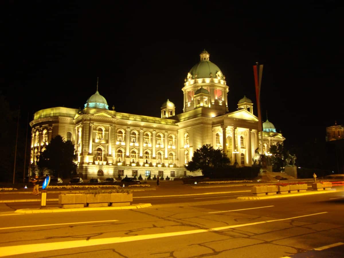 Belgrade's Parliament lights up the night sky. American in Belgrade