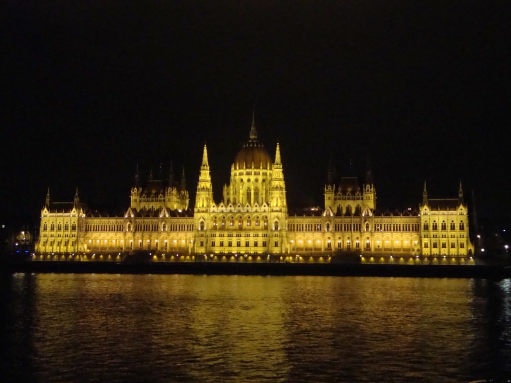 Budapest Parliament lights up the night sky across the Danube