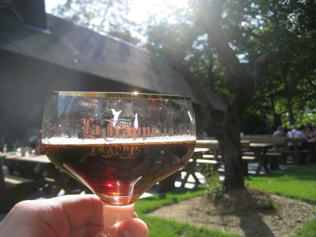 Sun light shines from the heavens into the beer on the terrace of the de Koningshoeven cafe, the La Trappe brewery