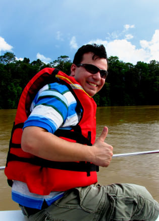 Alex on a boat along the Kinabatangan