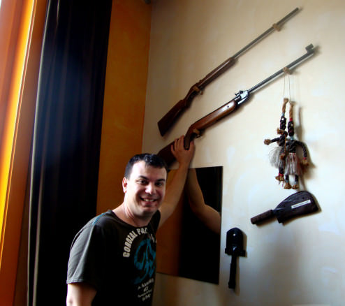 Alex and the guns in our safari themed room, Brugge, Belgium