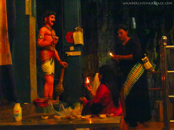 Praying inside the Batu Caves