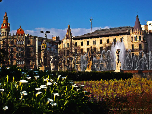 Barcelona - cityscape shot with buildings, garden and fountain