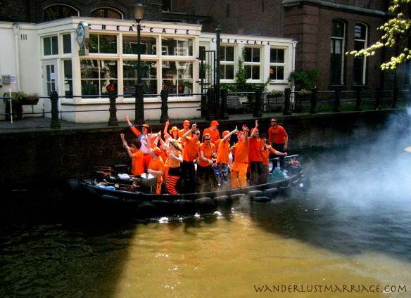 Queensday party on a boat on a canal 