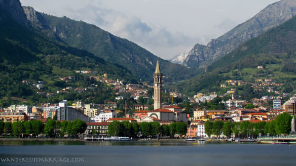 Lake Como with the alps and church and houses