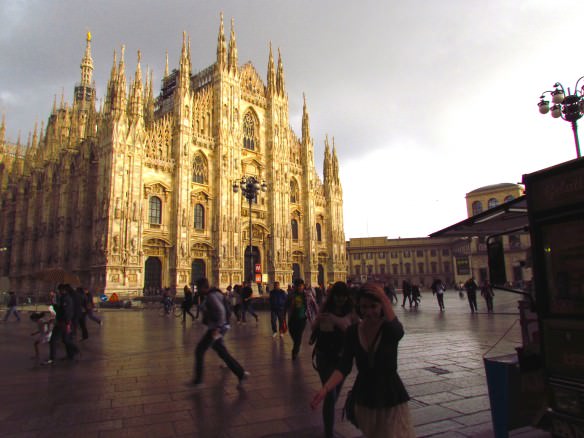 People running away from the Milan Duomo during a thunderstorm