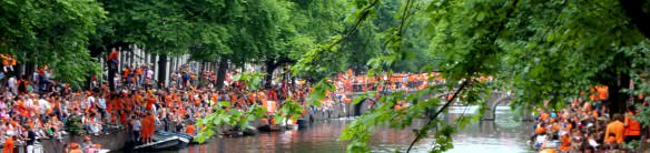 Dutch in Orange on Canal Bridge