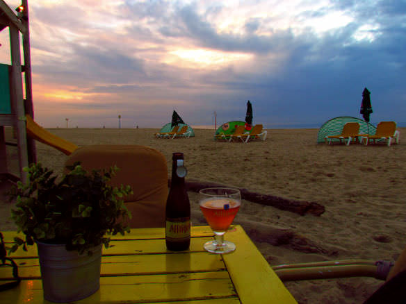 Belgian beer on Scheveningen beach at sunset