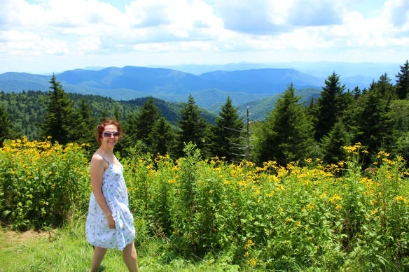 Bell posing with flowers along the Blue RIdge Parkway in North Carolina