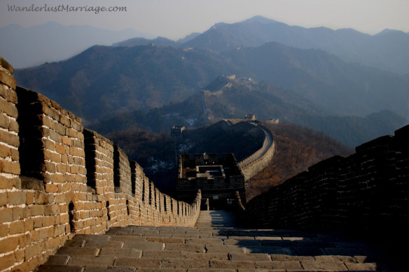 Looking down the wall with the mountains in the background