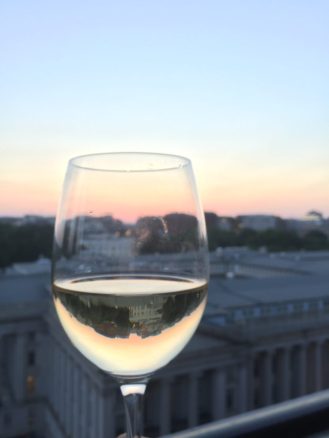 View of the White House from POV Rooftop Bar with a glass of white wine