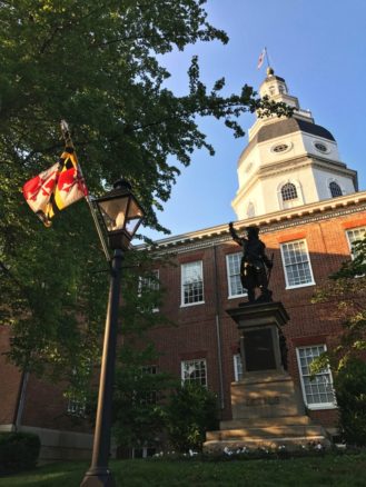 Annapolis, Maryland State House with statue and state flag