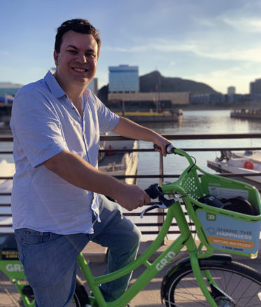 Alex riding a rental bike in Tempe, Arizona