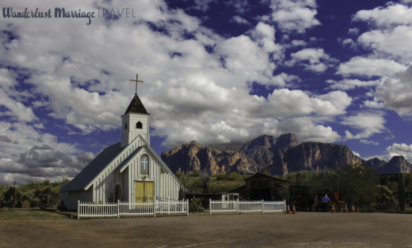 Elvis church with mountain backdrop and fluffy white clouds at Superstition Mountain Museum