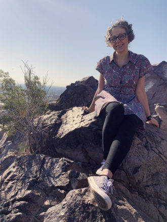 Hayden Butte, Tempe Bell sitting on some rocks