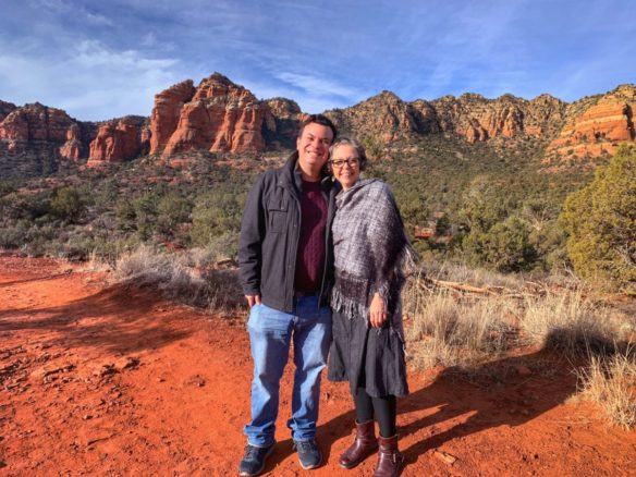 Alex and Bell along a trail in Sedona and the red rocks