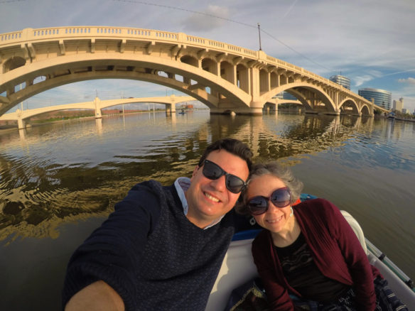 Alex and Bell on a paddle boat with Tempe in the background paddle boating on Tempe Town Lake 