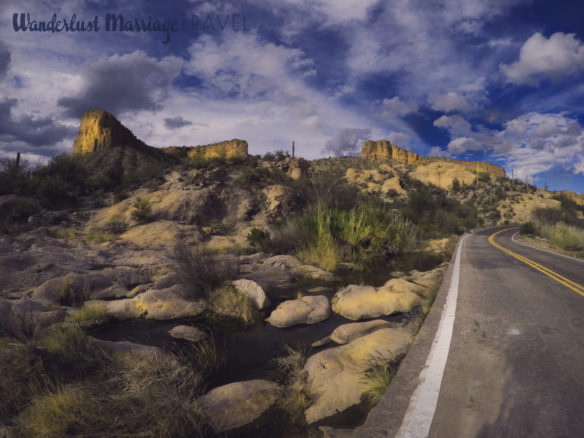 Road running through Tortilla Flat with rocks and cactus