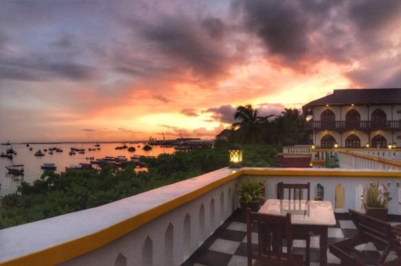 Sunrise over the sea, boats and balcony 