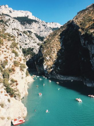 Gorges du Verdon with boats docked in the sea and blue skies