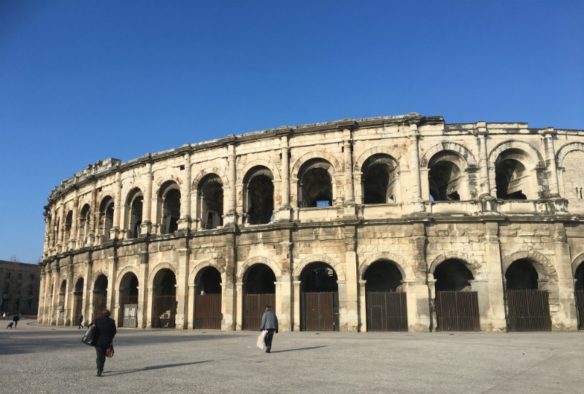 colossal Nimes Arena with blues skies