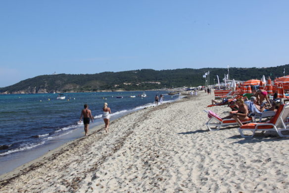 Beach with sun umbrellas in St Tropez 