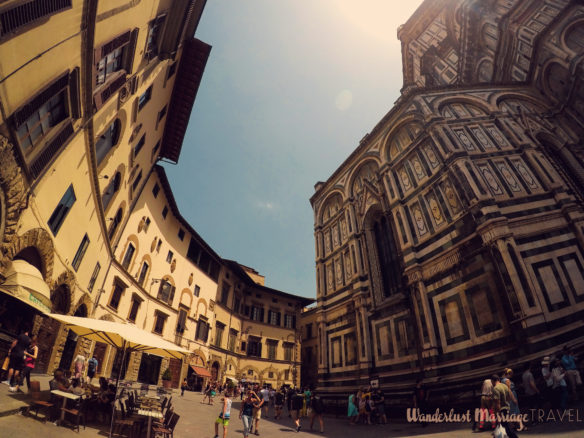 The Dumo cathedral and cafes on the opposite side of street in Florence