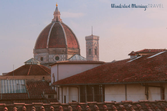 The large brick dome of the Dumo cathedral at dusk