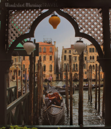 Guy sitting in his gondola in Venice, Italy