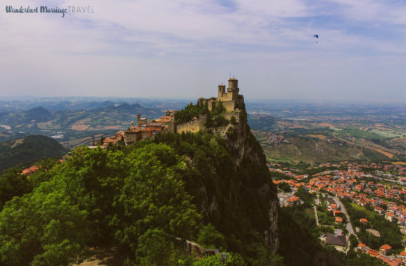 San Marino fort and mountains with a glider in the sky