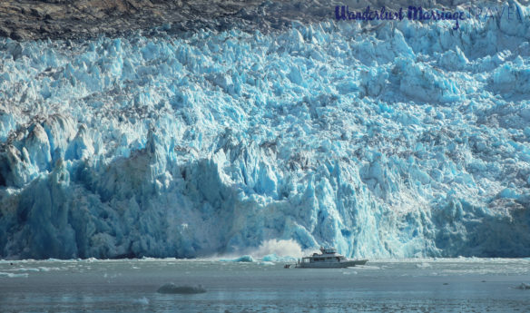 Part of the South Sawyer Glacier falling into the sea and creating a large splash