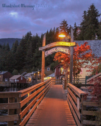 Creek Street sign at dusk and mountains in Alaska