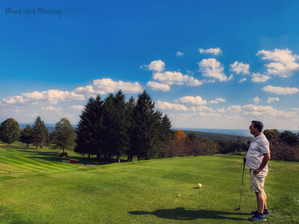 Alex looking down the golf green before teeing off at Seven Springs Resort