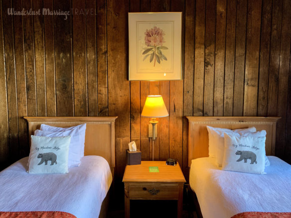 Cozy hotel bed in a log cabin