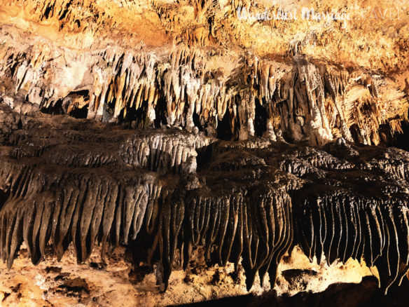 stalactites in hues of orange and browns in the caves