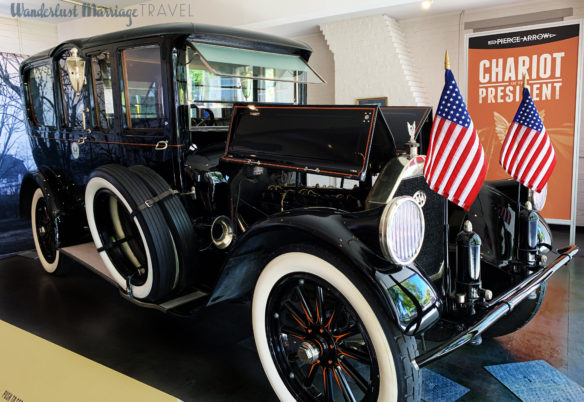 Wilson's black car with American flags