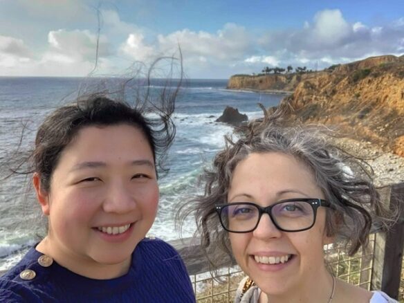 Bell and Fiona selfie in the cliffs with ocean in the background