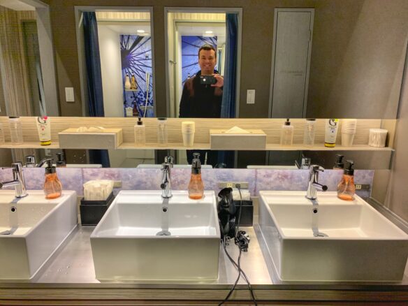 Bathroom with included toiletries on the counter with multiple sinks at at Hotel Cargo Shinsaibashi