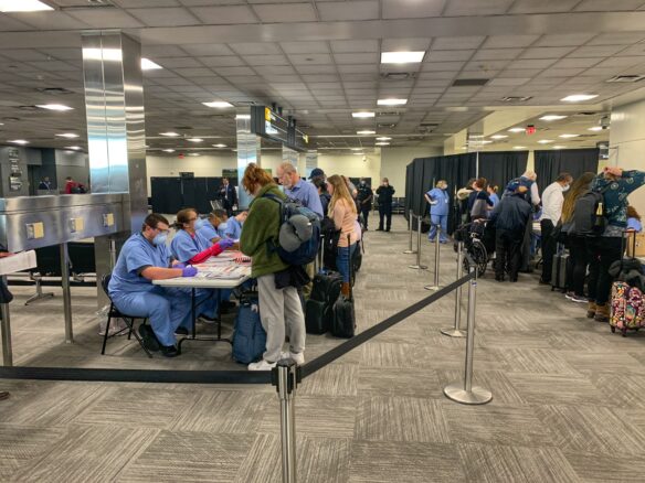 passengers receiving a health screening on arrival at Washington, DC Dulles Airport