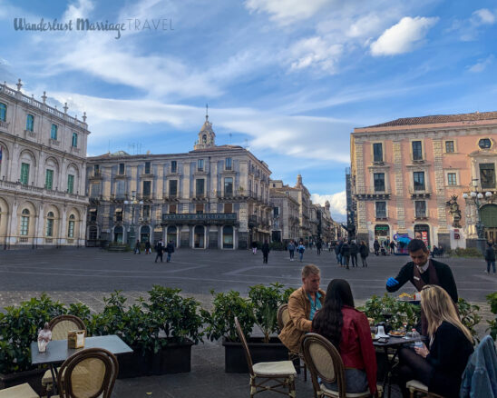 Square with cafe setting and blue skies