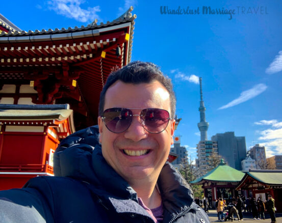 selfie of Alex at the Asakusa Temple, with Tokyo Skytree in the background