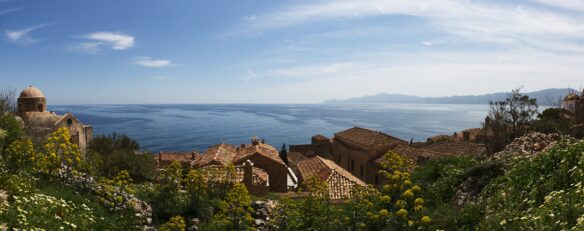 view atop the medieval walled town of Monemvasia, Greece, built on the side of the rock formation 200 meters off the mainland of the Peloponnese region of Greece