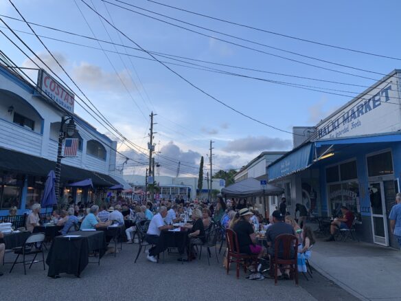 packed tables on Athens Street in Tarpon Springs, lined with Greek restaurants and shops - seen here during Athens by Night Festival.