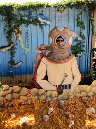 Alex and Bell posing behind the Sponge Factory display in Tarpon Springs