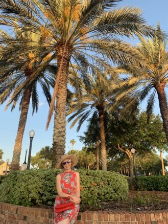 Bell sitting below palm trees in Craig Park, in Tarpon Springs. 