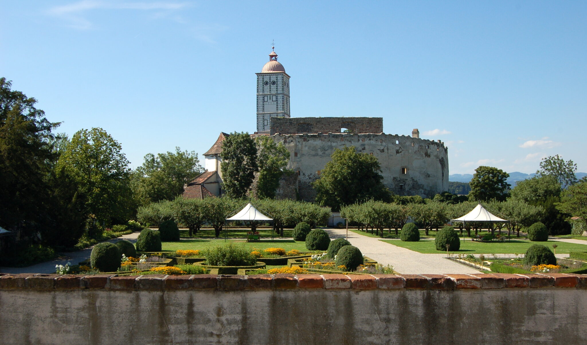 Schallaburge castle with its fortified wall and tower and manicured gardens