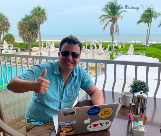 Alex working on his computer along the beach in Sanibel Island, Florida