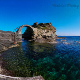 The Venetian Fortress and Bridge in Andros Chora, with a clear blue sky